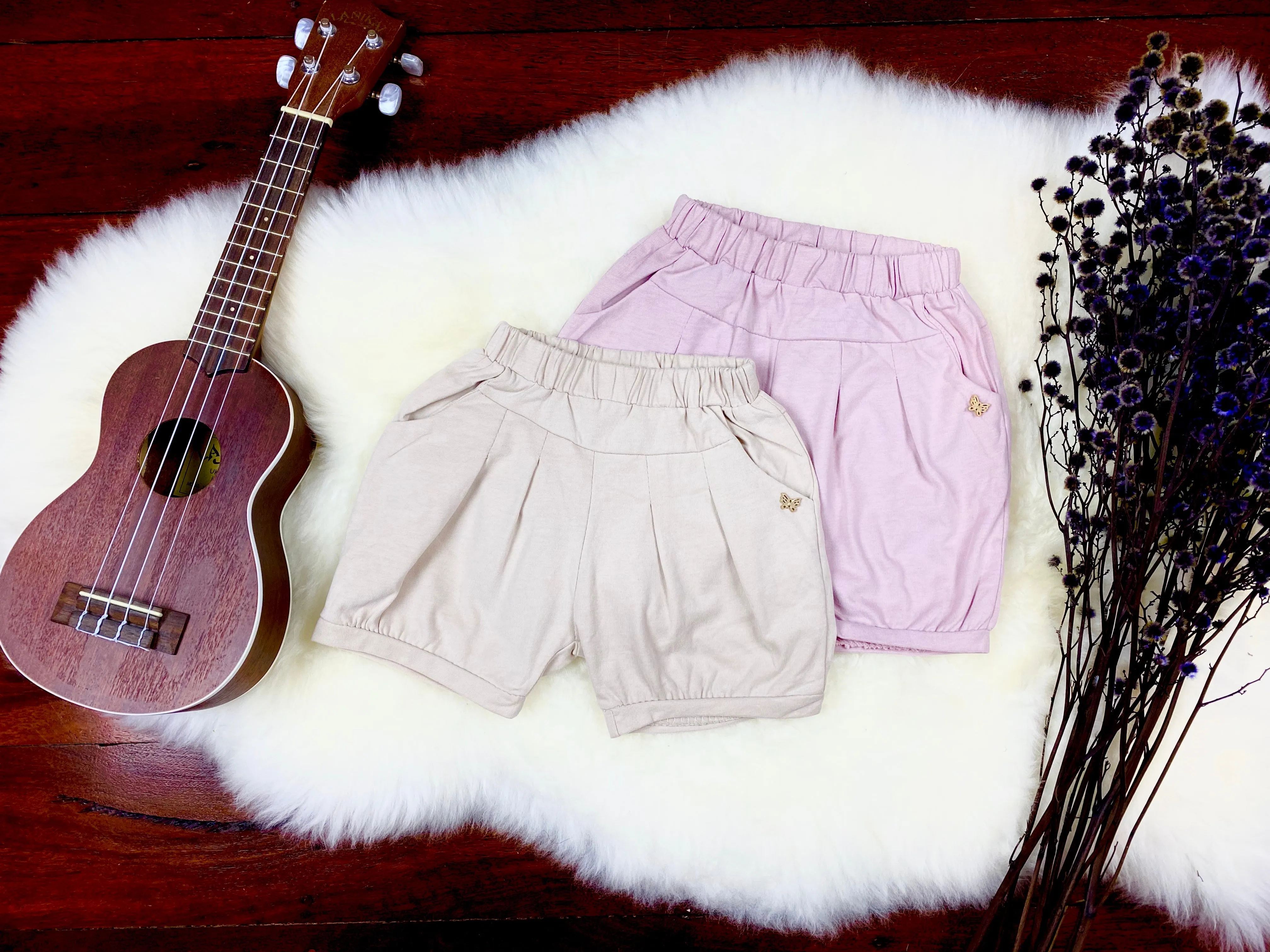 Shorts with butterfly stud
